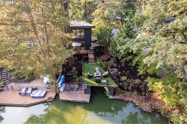 dock area featuring a deck with water view