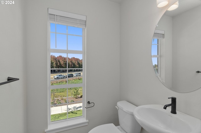 bathroom featuring toilet and sink