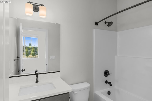 full bathroom with vanity, toilet, and shower / tub combination