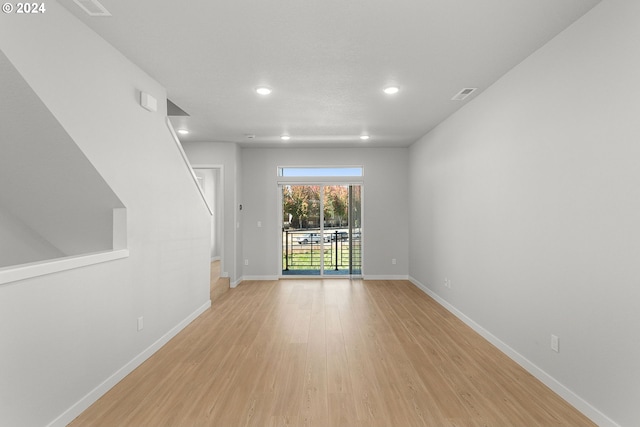 unfurnished room featuring light wood-type flooring