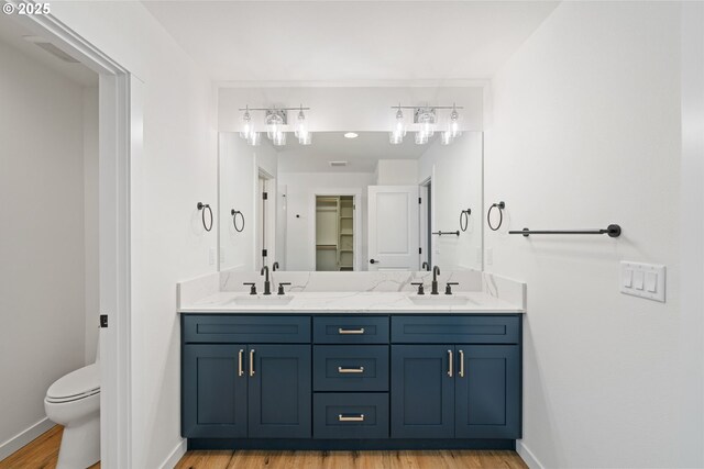 11108 NE 91st Ave, Vancouver, WA 98662 - bathroom with double vanity, wood finished floors, baseboards, and a sink