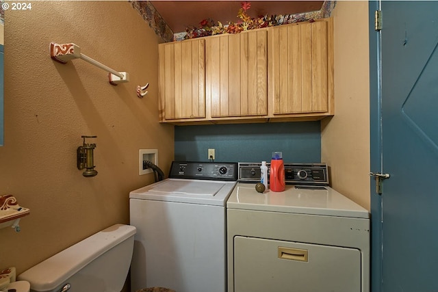 laundry room with cabinets and independent washer and dryer