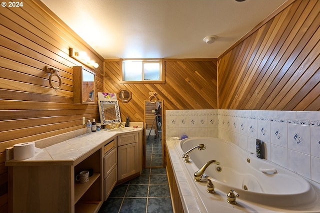 bathroom with wood walls, a bathing tub, vanity, and tile patterned floors