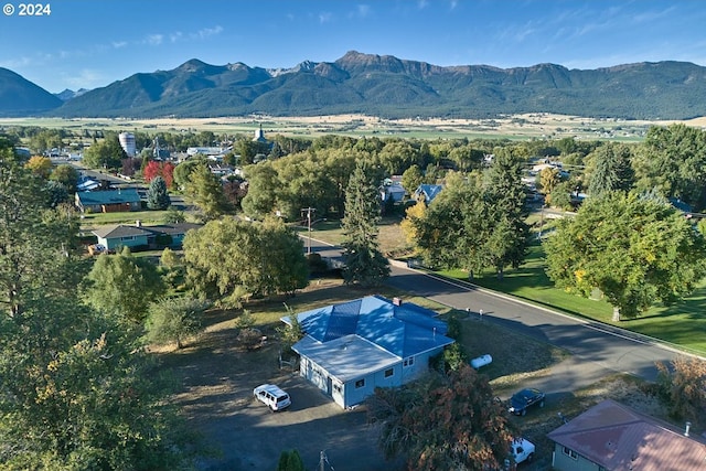 birds eye view of property with a mountain view