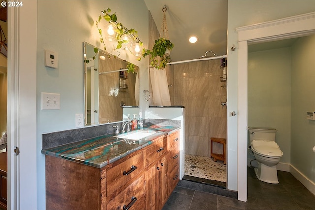 bathroom featuring vanity, a shower with curtain, toilet, and tile patterned floors