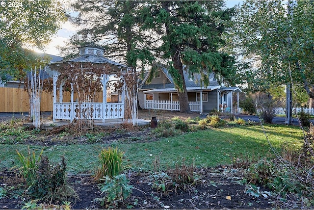 exterior space featuring fence and covered porch