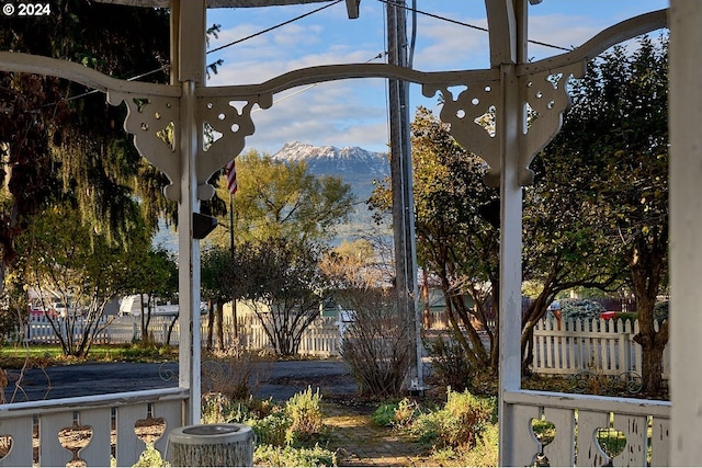 exterior space featuring a mountain view and central AC unit