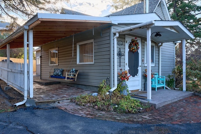 view of property exterior featuring a carport