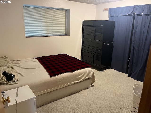 carpeted bedroom featuring a textured ceiling