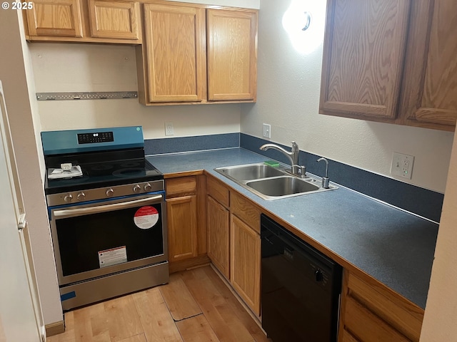 room details featuring light hardwood / wood-style flooring and stainless steel range oven