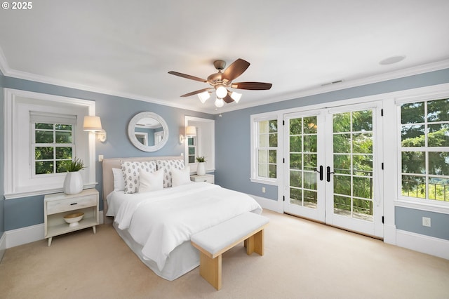4243 SW Bertha Ave, Portland, OR 97239 - carpeted bedroom with access to exterior, french doors, multiple windows, crown molding, and ceiling fan