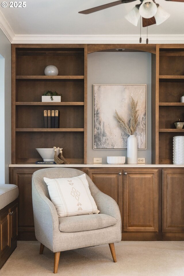 4243 SW Bertha Ave, Portland, OR 97239 - living area featuring ceiling fan, crown molding, and built in shelves