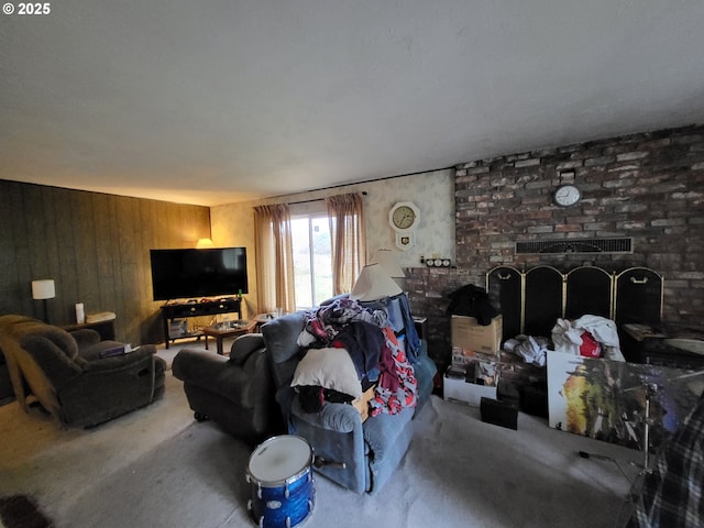 living room with a fireplace and wood walls