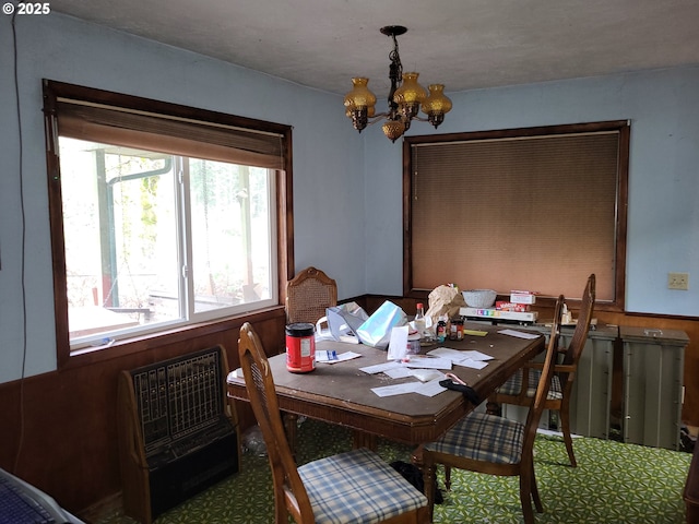 dining space with a notable chandelier