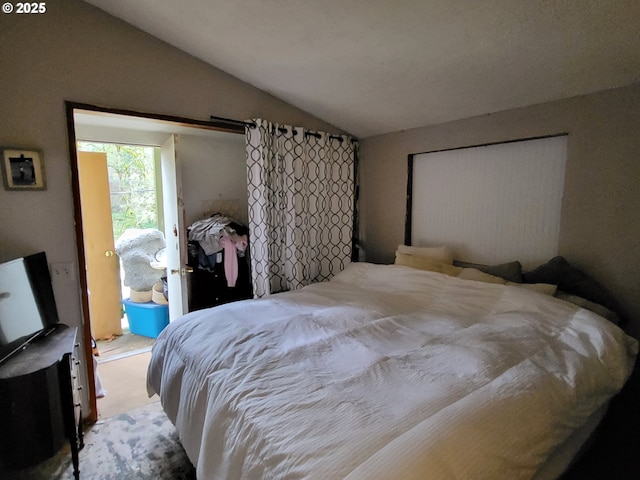 bedroom with vaulted ceiling