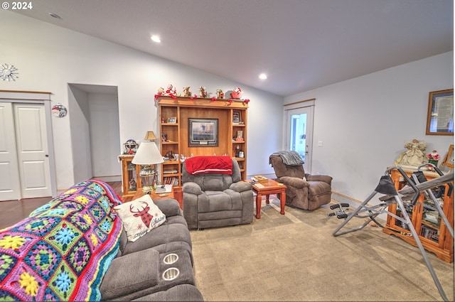 carpeted living room with vaulted ceiling