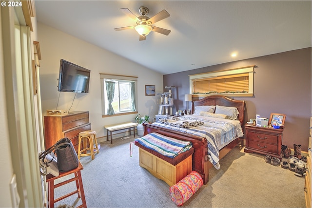 bedroom featuring vaulted ceiling, ceiling fan, and carpet flooring