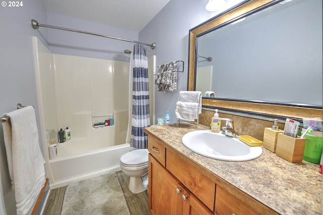 full bathroom featuring hardwood / wood-style floors, shower / bath combination with curtain, vanity, toilet, and a textured ceiling