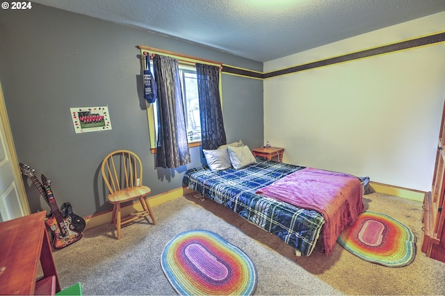 carpeted bedroom with a textured ceiling