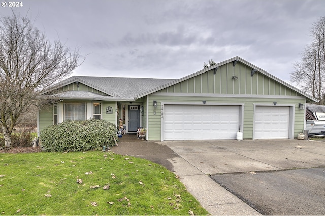 single story home with a garage and a front yard