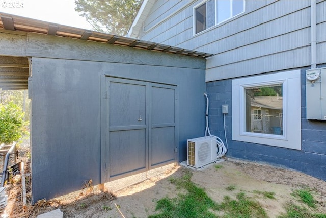 exterior space with ac unit and concrete floors