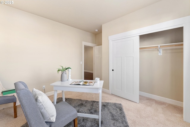 carpeted home office with baseboards