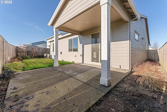 back of property featuring a patio area, a yard, and central AC unit