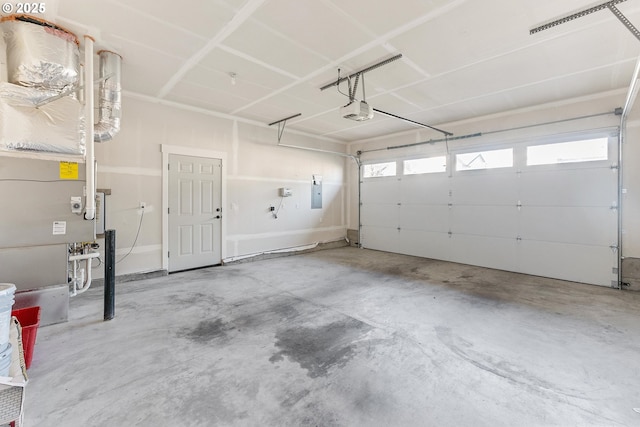 garage with electric panel, a garage door opener, and heating unit