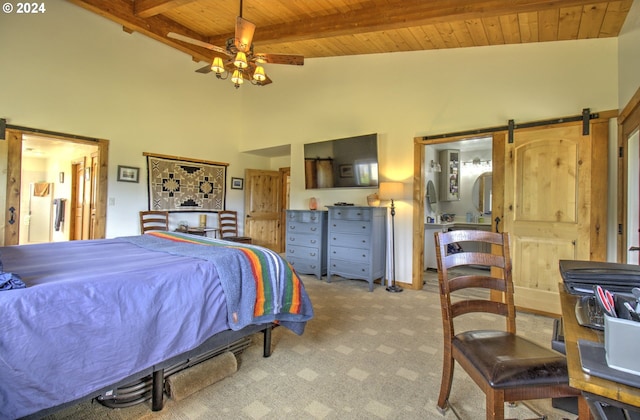 carpeted bedroom with beam ceiling, ceiling fan, a barn door, high vaulted ceiling, and wood ceiling