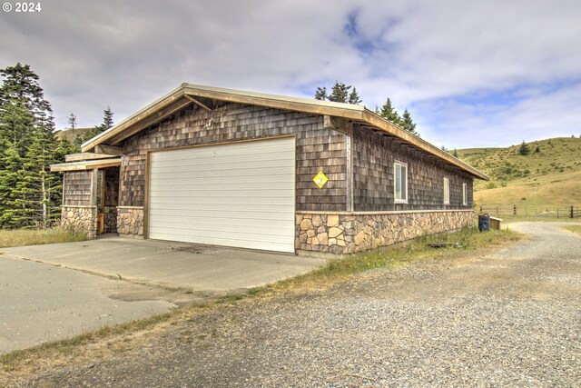 view of front of home featuring a rural view