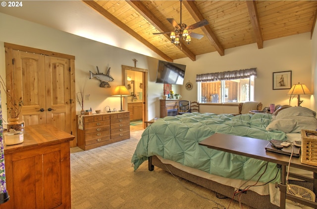 bedroom with ceiling fan, wooden ceiling, vaulted ceiling with beams, ensuite bathroom, and light carpet