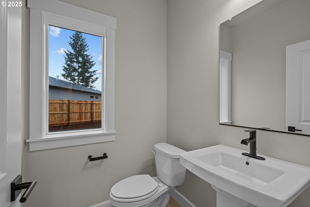 bathroom featuring sink and toilet