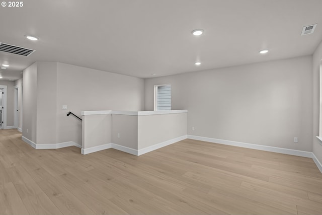 unfurnished room with light hardwood / wood-style flooring