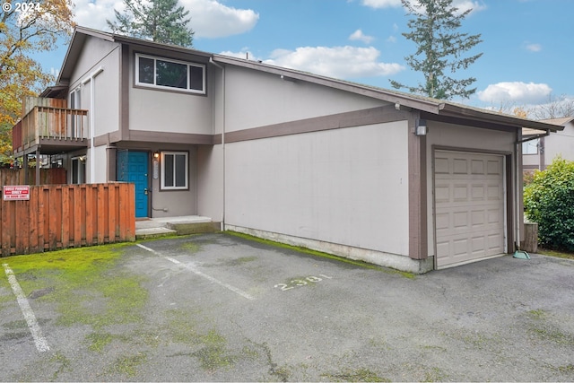 view of side of property with a garage