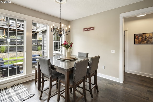 dining room featuring a chandelier and hardwood / wood-style flooring