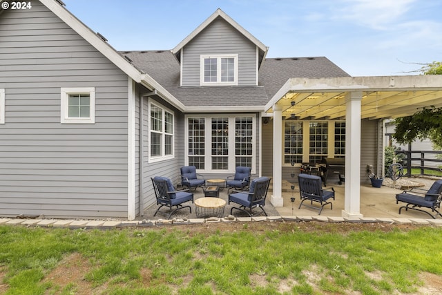 back of house featuring a patio area and an outdoor hangout area