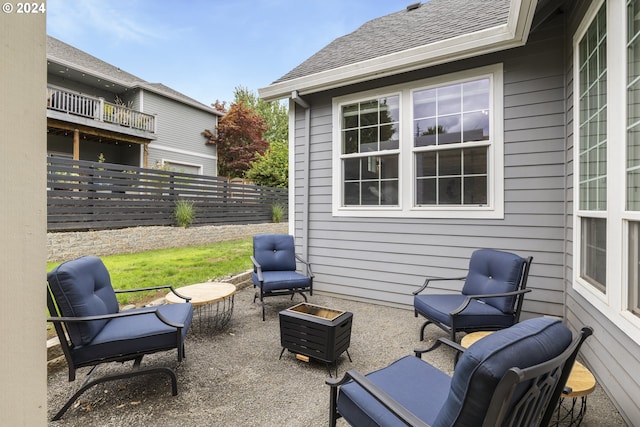 view of patio featuring a balcony