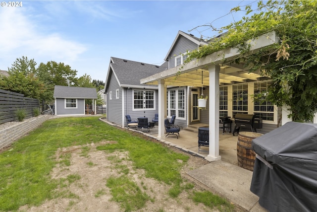 back of property featuring a patio, outdoor lounge area, and a lawn