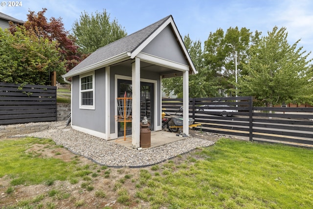 view of outdoor structure featuring a lawn