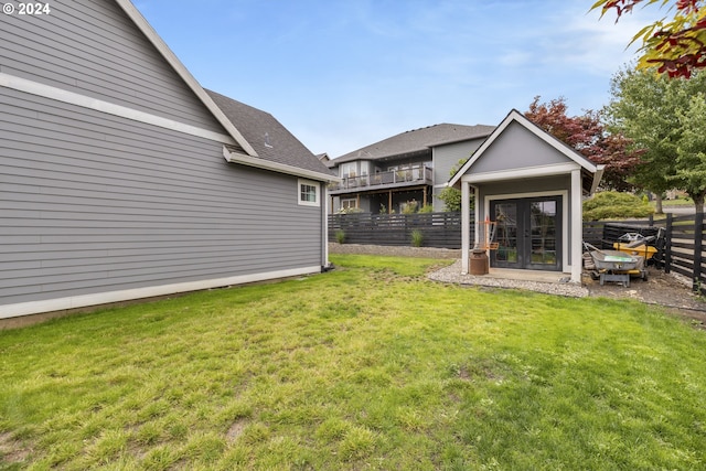 view of yard with french doors