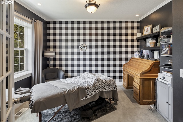 bedroom with crown molding and light carpet