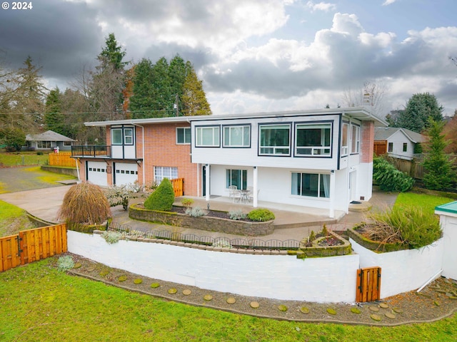 view of front of home with a garage