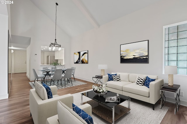 living room with an inviting chandelier, beam ceiling, high vaulted ceiling, and wood-type flooring