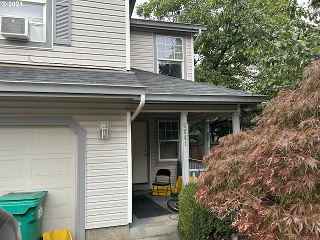 doorway to property featuring a garage