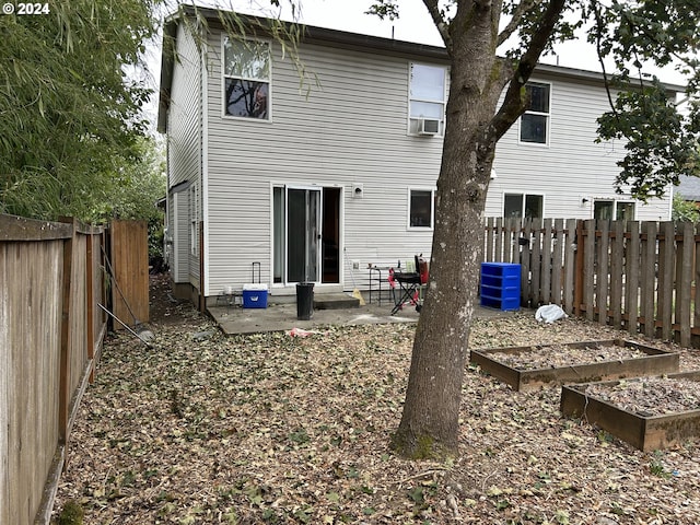 back of property with cooling unit and a patio area