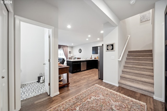 foyer entrance with hardwood / wood-style flooring