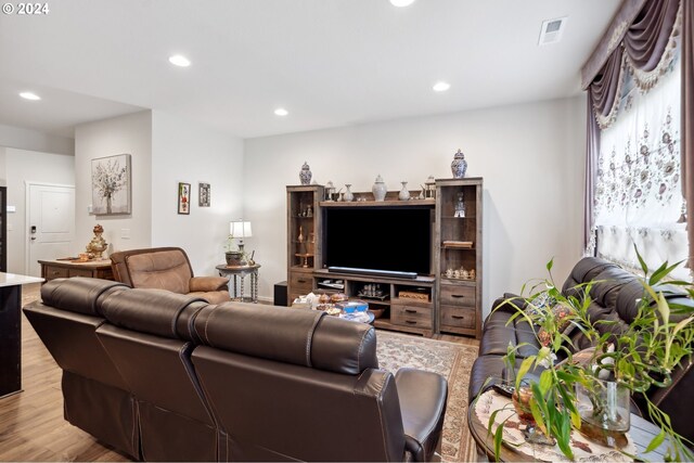 living room with light hardwood / wood-style floors