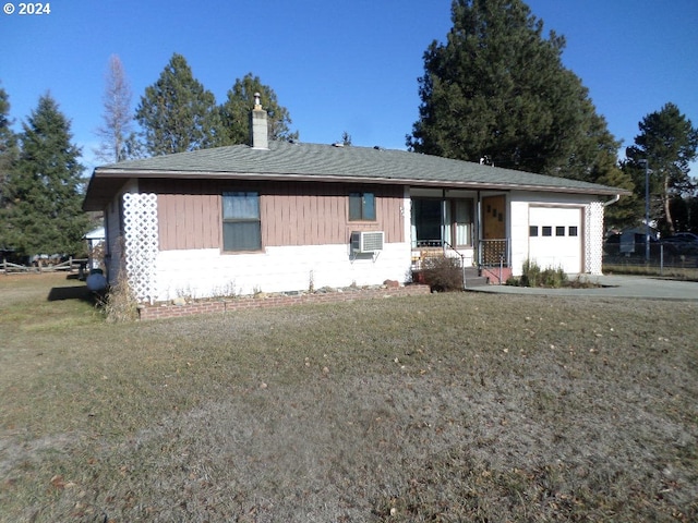 ranch-style house with a garage and a front yard