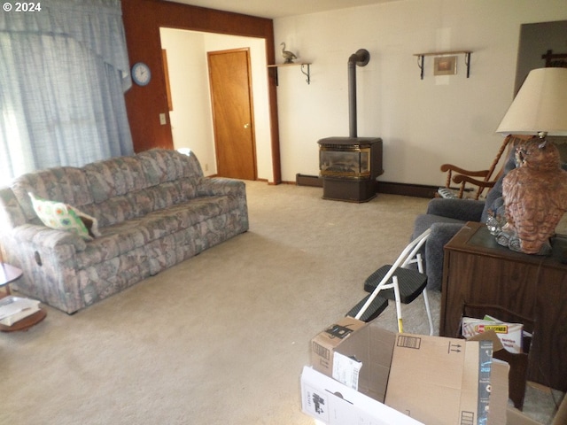 carpeted living room featuring a wood stove