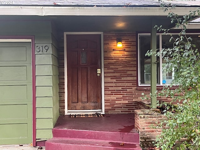 property entrance with covered porch